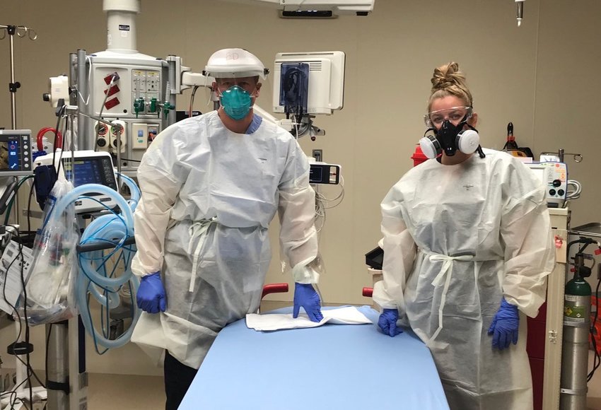 Dr. Kimber Bogush, emergency medicine physician, and emergency room nurse Mia Orr are pictured in the trauma bay during their shifts at the UCHealth Highlands Ranch Hospital Emergency Department on Friday, March 27, 2020.